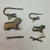 Antique-style brass padlocks featuring a lion and a dog or small lion cub, crafted with a traditional puzzle or trick...
