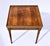 A refined vintage Baker Furniture Louis XVI-style table, exquisitely crafted in book-matched walnut, single drawer with...