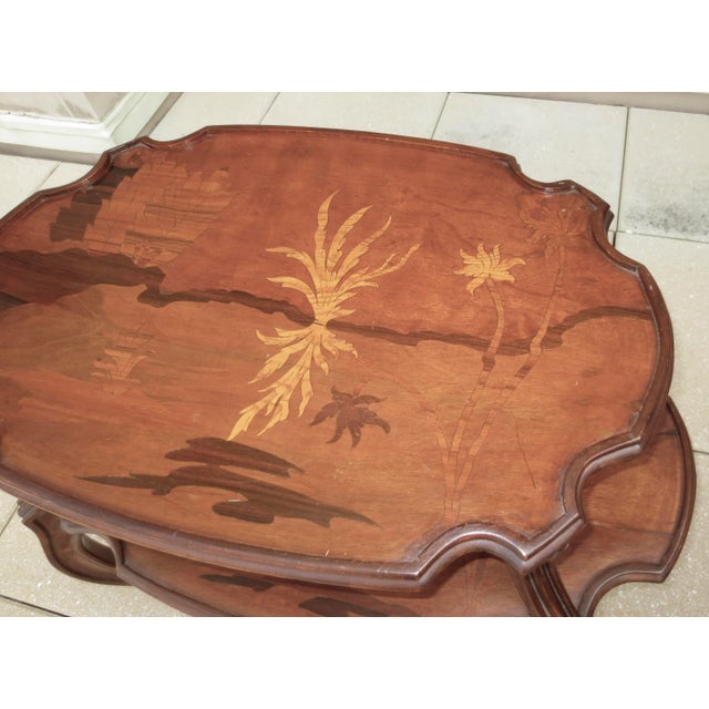 Marquertryinlaid three-tier side table. Bombay-shaped profile with art nouveau curved legs with fluted channels, Contoured...