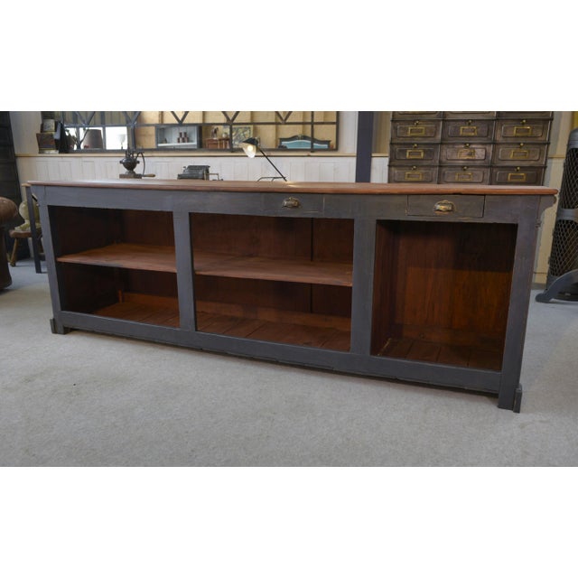 Antique 1930s fir shop counter, elm burl top, shell handles and metal label holders.