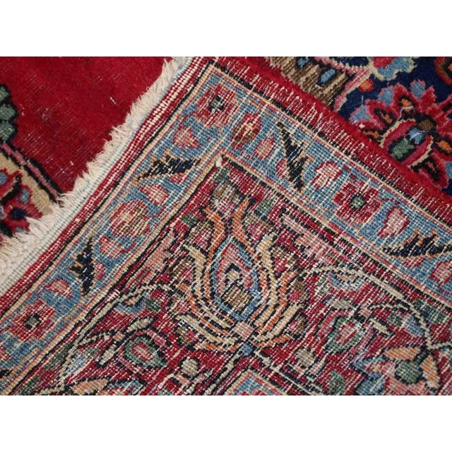 Vintage Persian Kazvin rug in bright red colour. The rug is from the end of 20th century. It is in original condition, has...