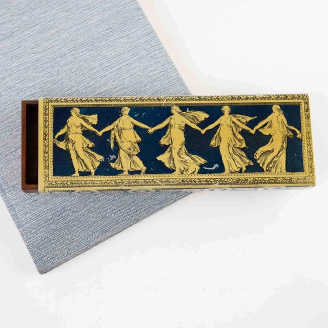 Elegant vintage metal decorative box featuring five dancing muses in classical Greek-inspired design. This functional...