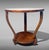 Refined and elegant Italian Art Deco coffee table crafted in walnut. Characterized by clean, harmonious lines, it features...