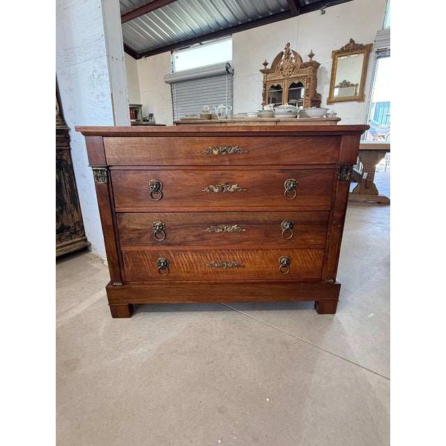 19th Century French Empire Commode from France. Made of solid walnut, the wood has been finished with a lustrous French...