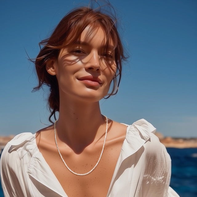 A whisper of light and shadow — the Lustra Necklace captures the poetry of contrast. Tiny freshwater pearls glow with...