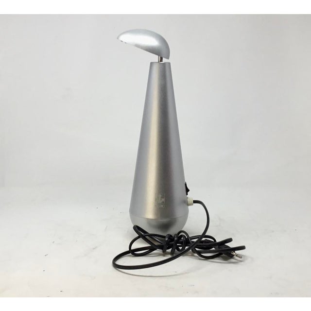 A striking and quintessential piece of Postmodern lighting, this "Birillo" table lamp by Forma Lighting offers minimalist...