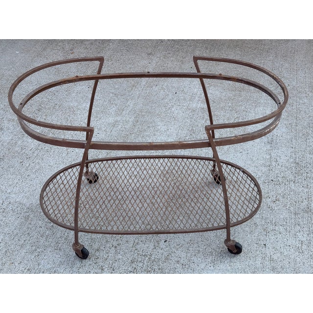Vintage Woodard style wrought iron bar cart. Original finish with no glass insert, giving you the option to repaint and...