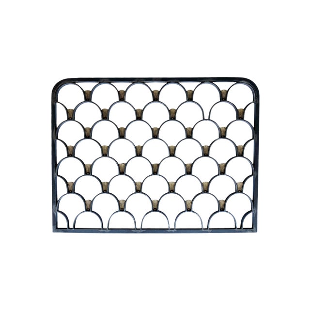 Beautiful pair of hand-forged steel and brass grates, a rare architectural find believed to date back to the Art-Deco...