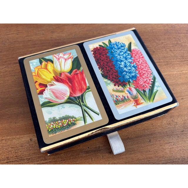 Complete double deck botanical pair of playing cards in a velvet box. Feature two favorite spring bulbs, the tulip and the...