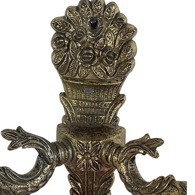Antique art deco wall mounted lamp. Made from brass and colorfully decorated glass that has a skirt motive on the bottom....