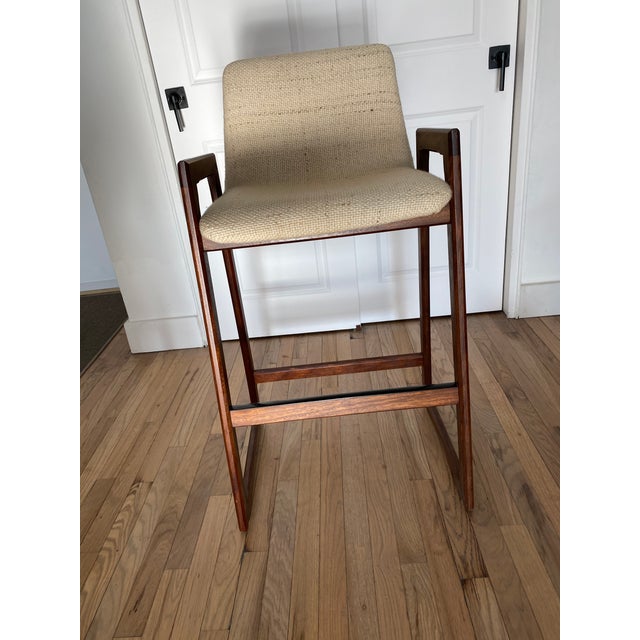 Mid century teak Danish bar stools in original condition. Normal wear and tear. Knobby wool oatmeal color with varying...