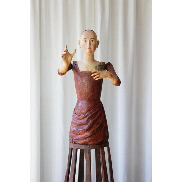 This wood sculpture has been beautifully designed with so much attention to detail that it appears realistic, and it is...