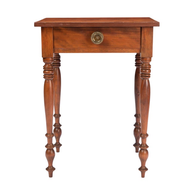 An American Sheraton one-drawer stand in curly birch, made in the Upper Connecticut Valley around 1820. The single-board...
