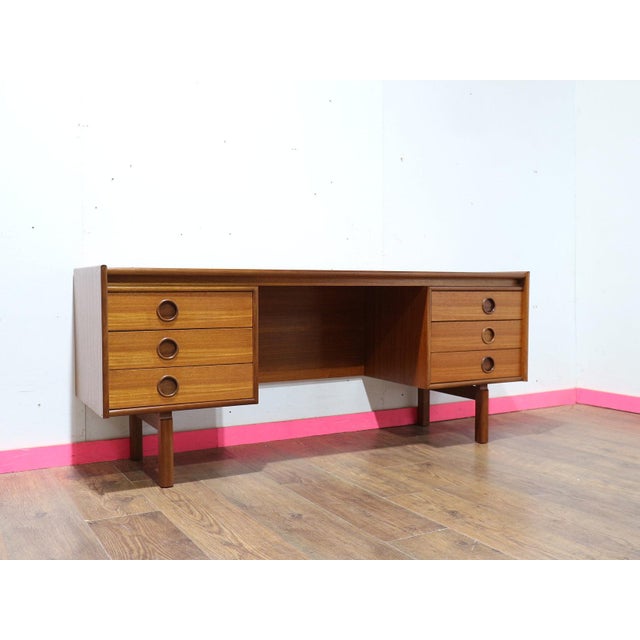 Enhance your living space with this Mid Century Modern Vintage Teak Vanity Desk Dresser by Bath Cabinets. Crafted by the...