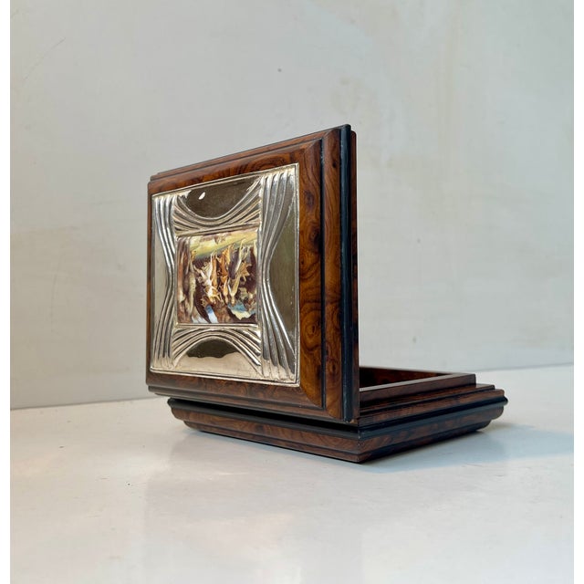 Decorative burl wood box with a small painted porcelain scene framed in 925 sterling silver. Made by Lacado in Spain circa...