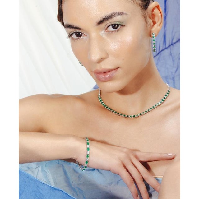 This is part of Chairish’s Fine Jewelry assortment. This Natural Emerald and Diamond Tennis Bracelet in 18K gold showcases...