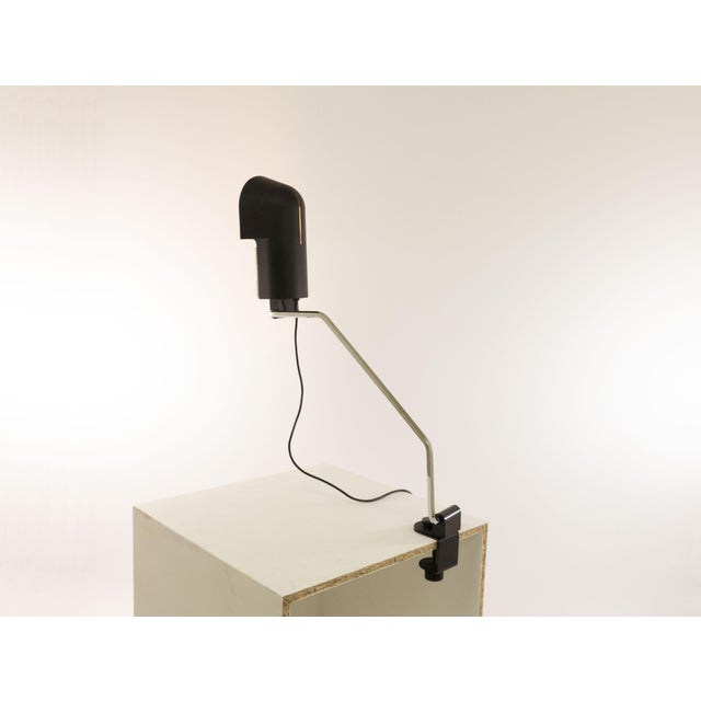 Black Pala clamp table lamp by Corrado and Luigi Aroldi for Luci, designed around 1970. The shade is made of lacquered...
