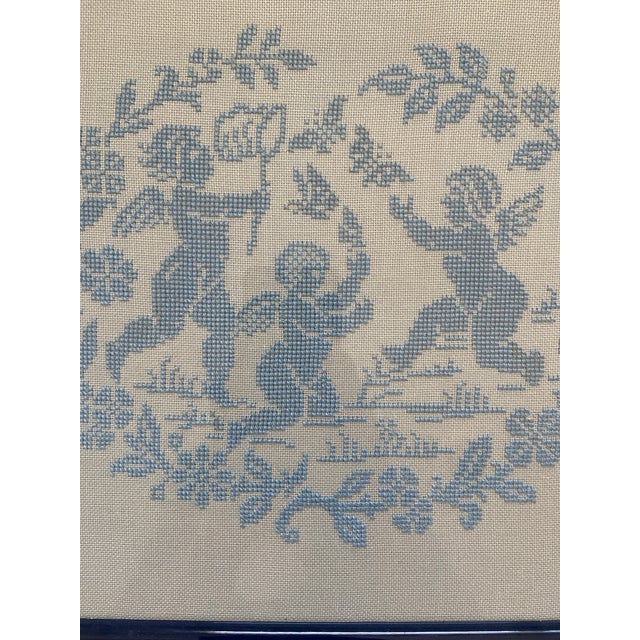 Beautiful needlepoint textile Light blue needlepoint, framed in a dark navy wood lacquer frame 13"W x 11.5"H Ready to hang