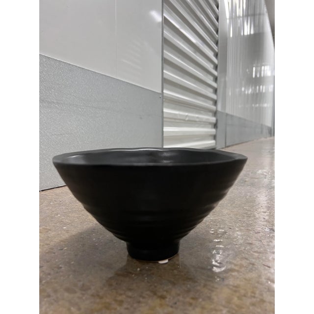 Beautiful ribbed ceramic bowl, in a dramatic black finish , use as a catch all in office on a desk, or great as accent for...