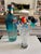 A large collected set of 16 hand-blown glass cocktail stirrers featuring a colorful underwater assortment of tropical...