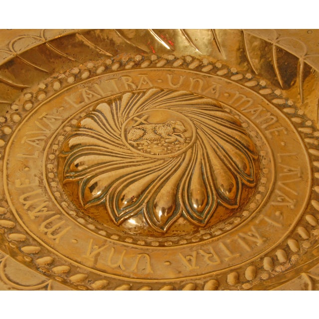 18th century large Alms dish of gold shiny brass depicting Lamb of God metaphor. In the center the Lamb of God set within...
