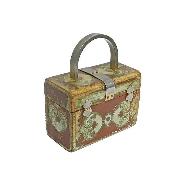 This is a vintage, Italian, Florentine style, wooden purse from 1910-1950. The purse features a gold steel loop handle and...