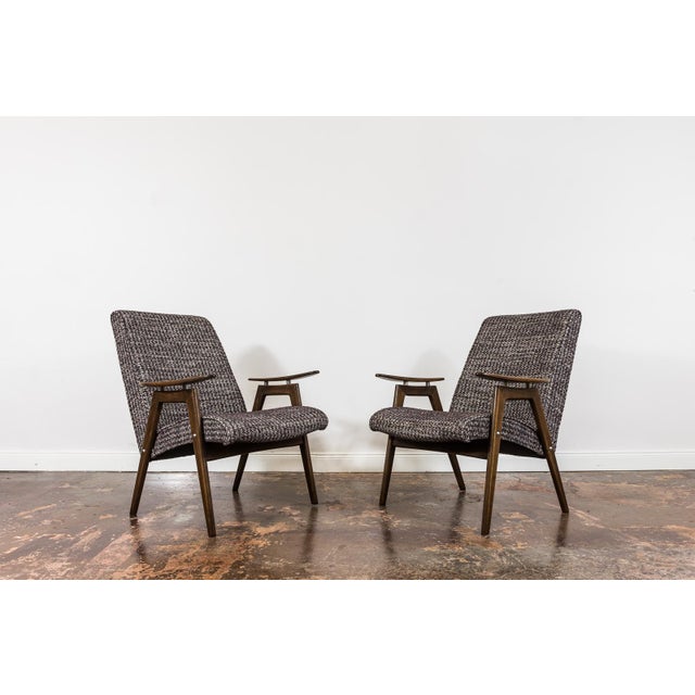 A pair of vintage armchairs designed by Jaroslav Smídek in the 1960s for Ton, Czechoslovakia. The armchairs are made of...