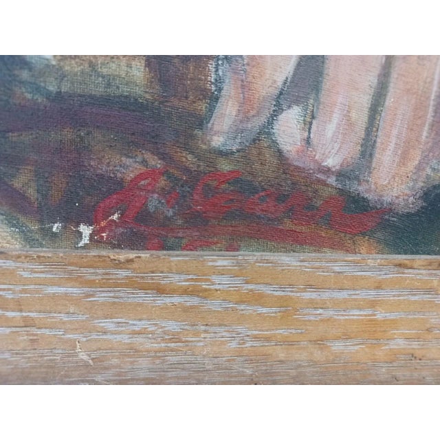 Vintage framed oil painting on canvas of seated gentleman in chair. Signed in red paint lower right corner