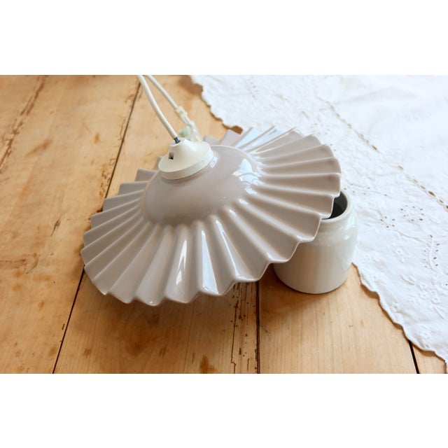 Vintage glazed ceramic pendant light in a soft lilac shade with taupe undertones. Its generously pleated shape and...