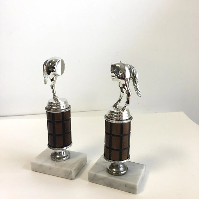 A fun pair of equestrian trophy bookends. The horse behinds are comical and whimsical, they would make great conversation...