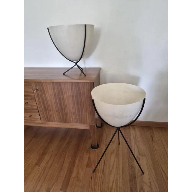 Truly amazing set of oriiginal Mid Century modern bullet planters. They are made of fiberglass with metal tripod stands....