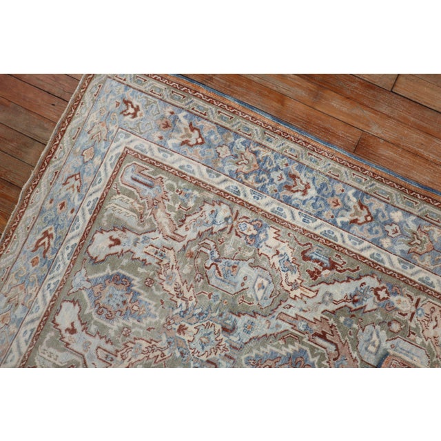a scatter size Persian rug from the early 20th century featuring a dragon design Measures: 3'5'' x 4'11''.