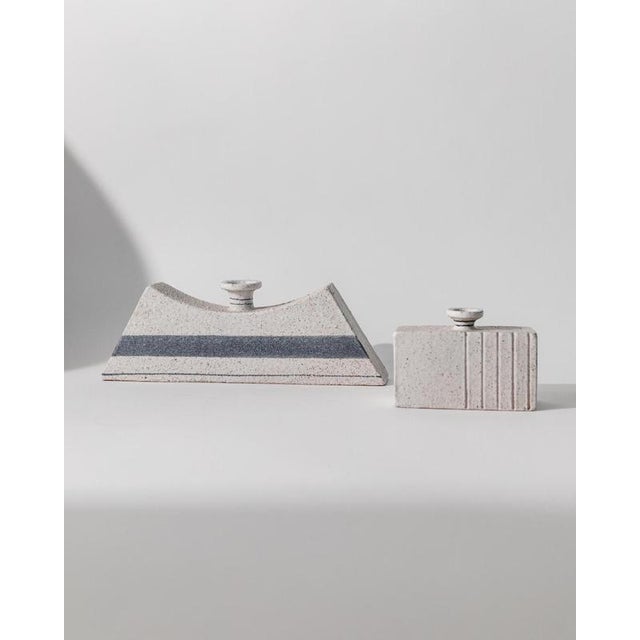 This vintage set of 2 ceramic vases from 1980s Italy features two striking geometric designs by Vanni. One vase is...