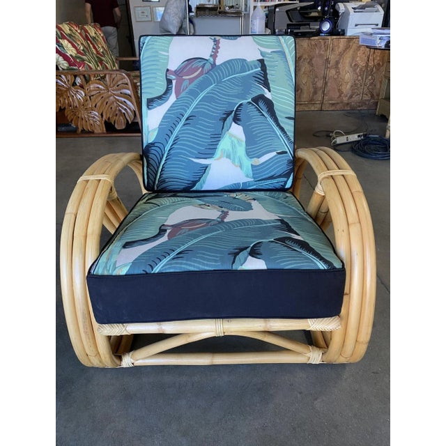 This round 3/4 pretzel arm rattan lounge chair and three-strand round pretzel arms and an "Arched" base. 1950, United...