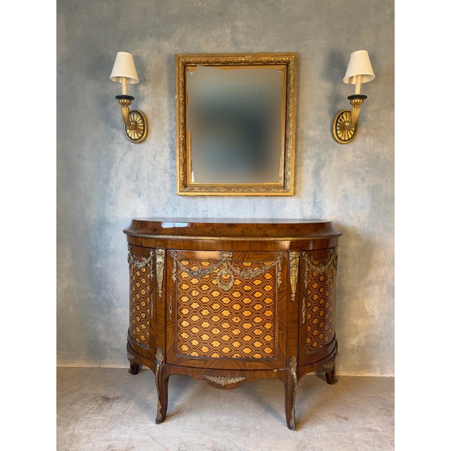 Vintage neoclassical transitional marquetry commode. The transitional period added more geometric shapes while still...