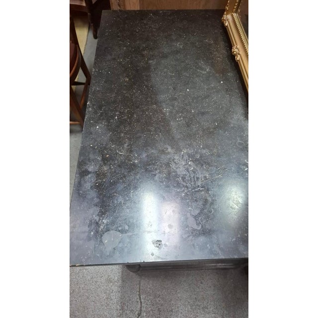 Small Empire-style mahogany commode with a marble top and four drawers. This commode has detached columns and dates from...