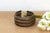 This bronze exchange is a storied artifact of West African economic history. Known as a Manilla, these open-cuff bracelets...