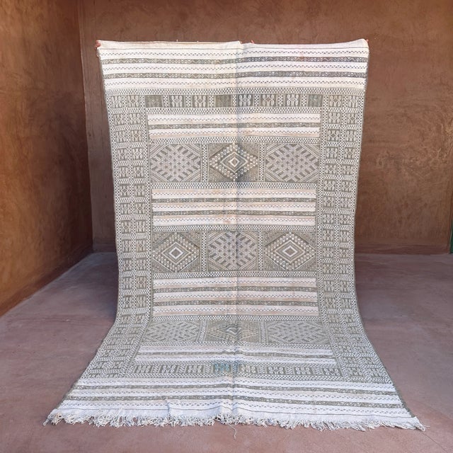 This vintage Moroccan rug is a true powerful women's artistic creation that is the first thing our eyes get caught when we...