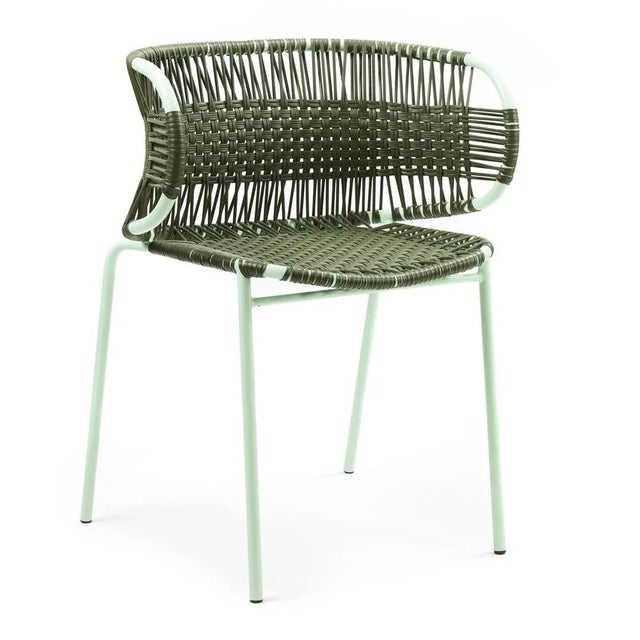 Olive cielo stacking chair with armrest by sebastian herkner materials: galvanized and powder-coated tubular steel. Pvc...