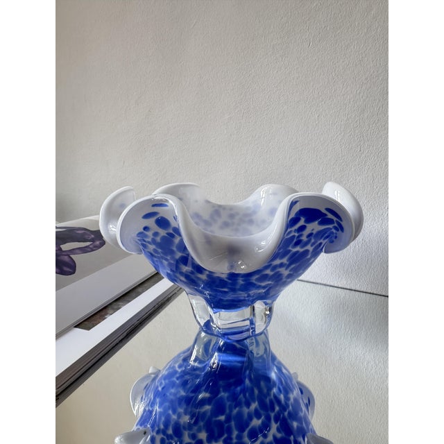 A sculptural art glass bowl produced for Royal Gallery in Poland in 1999. The piece features a fluid, free-form silhouette...