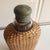 A completly useable Edwardian liquor bottle. Glass with woven rattan cover. Screw top