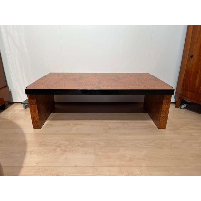 Low rectangular art deco sofa of coffee table from France about 1930. Amboyna roots wood veneered and lacquered. Black...