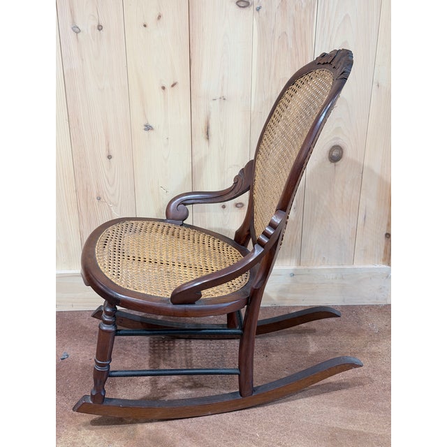 Victorian Vintage Victorian Mahogany Cane Back Rocking Chair With Carved Crest For Sale - Image 3 of 7