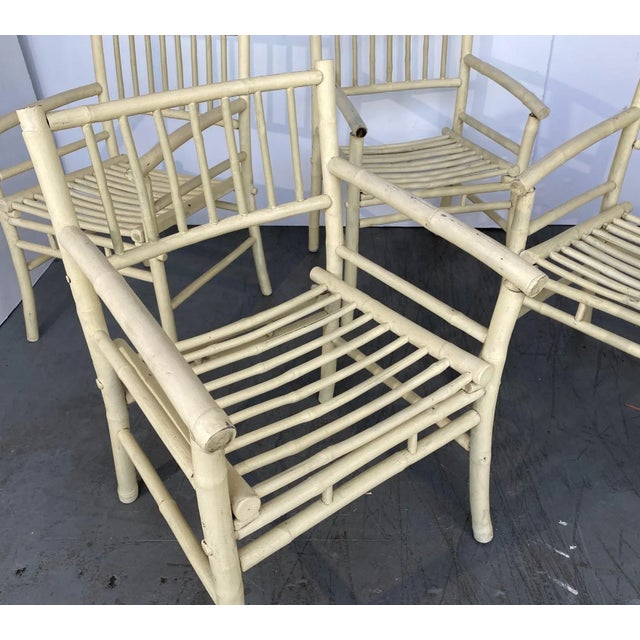 A set of four hickory-style painted armchairs.