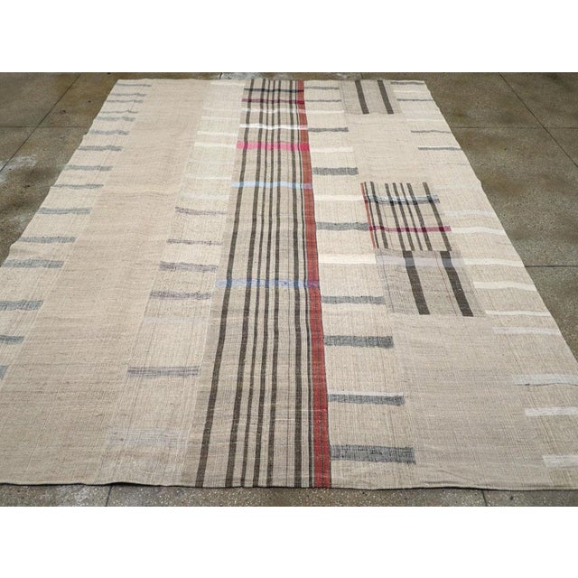 A vintage Turkish flatweave Kilim room Size carpet handmade during the Mid-20th Century. Measures: 10' 0" x 13' 0".