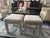 Offered is a pair of 1970s upholstered ottomans that have been professionally reupholstered and a lovely neutral grayish...