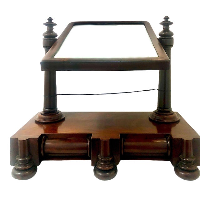 On offer is a highly distinctive Antique Empire/Regency style mahogany dressing table vanity mirror. Such a piece was...