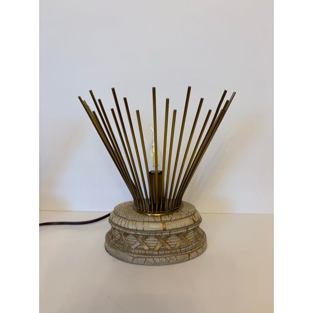 This pair of Mid-Century Modern inspired desk lamps, often identified as the sunburst or starburst style and they feature...