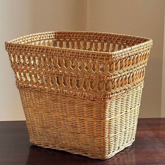Offering a beautiful and extremely well preserved mid-20th century wicker wastebasket. This exquisitely handwoven...