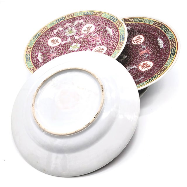 This is a set of 4 Chinese Mun Shou plates. This medium-small 7 inch plate is adorned with traditional Chinese longevity...